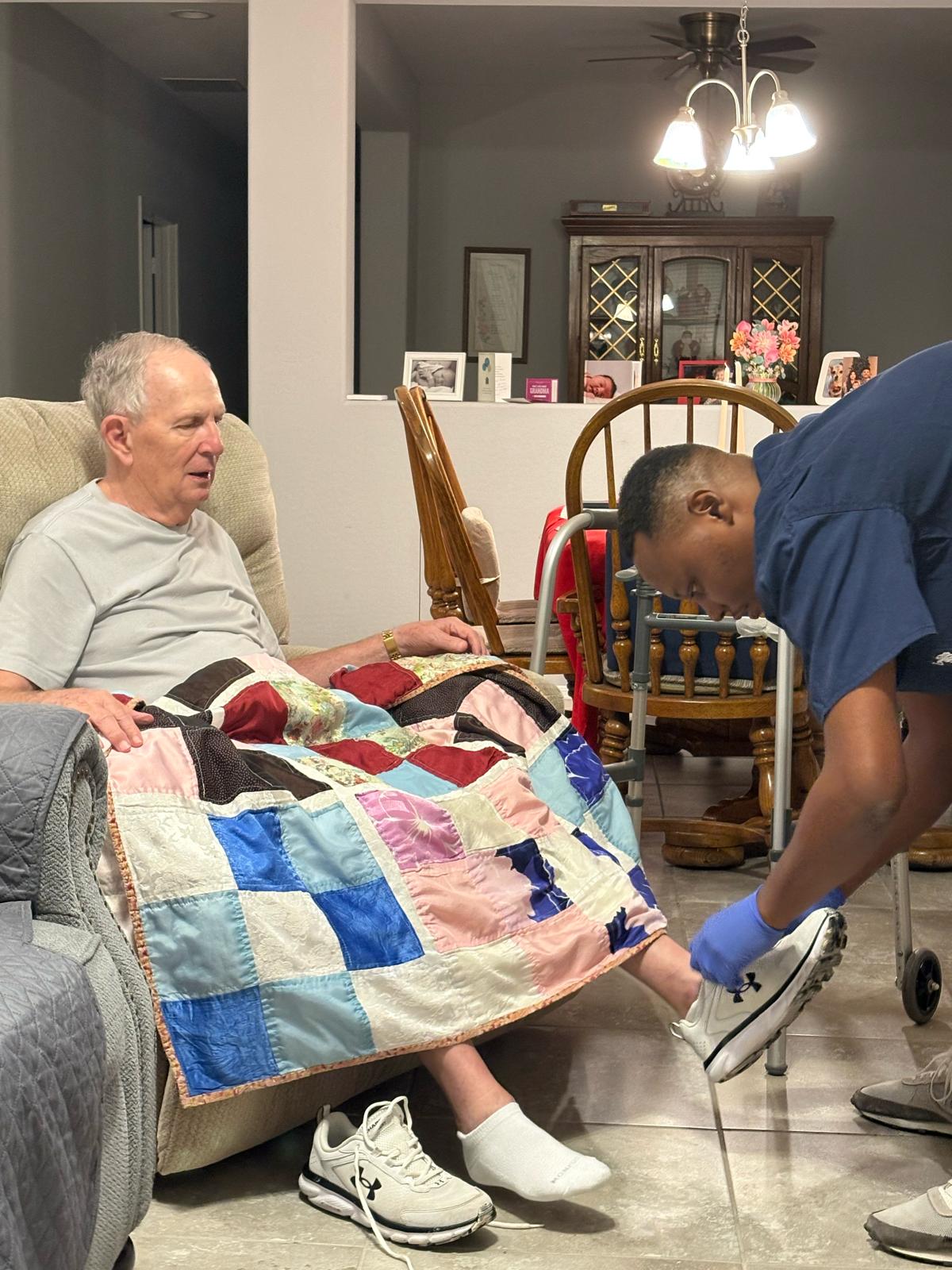 Caregiver assisting a senior client at home